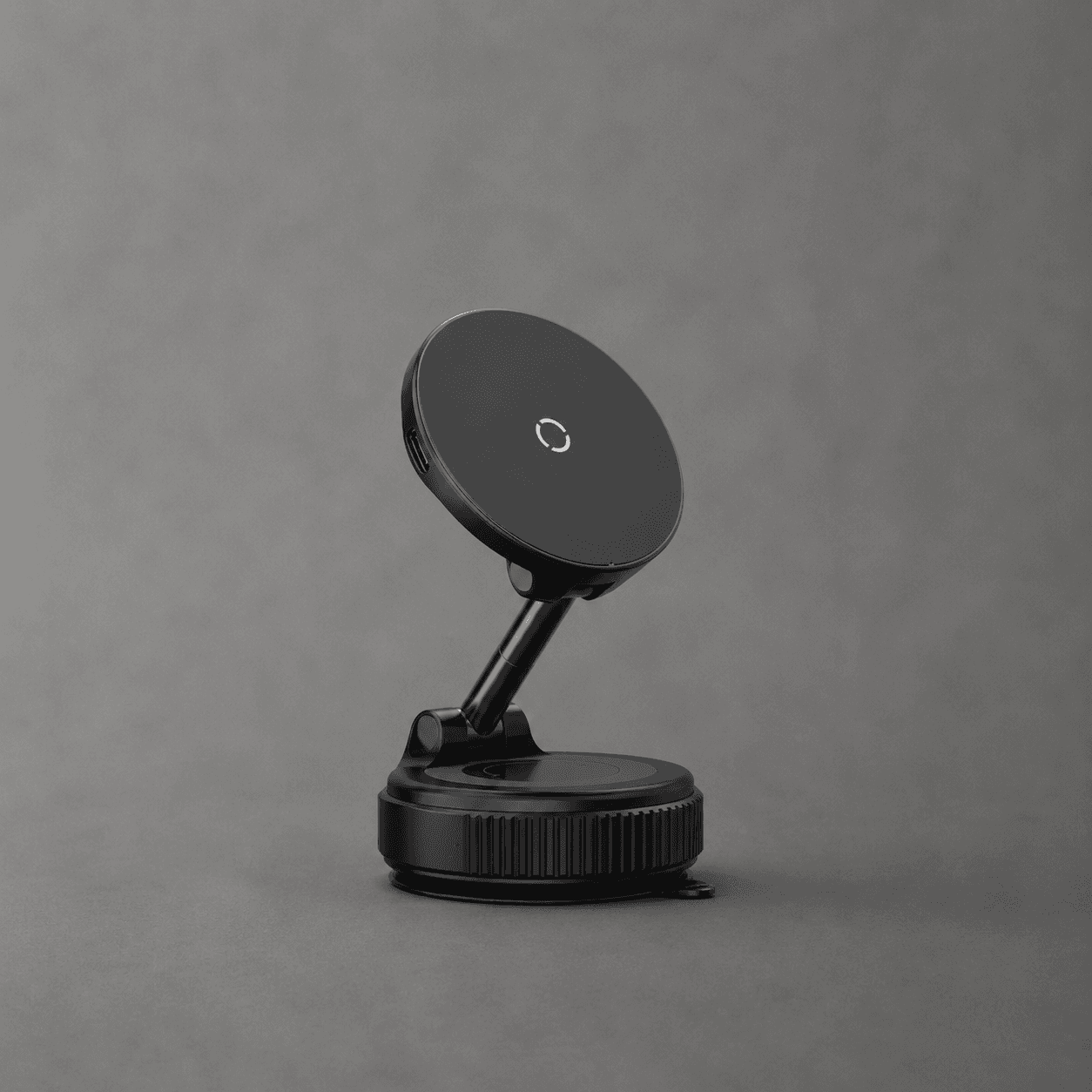 Svart magnetisk mobilhållare med vakuumsug